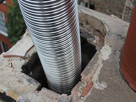 chimney relining Pawtucket by 5 Star Chimney Service installing stainless steel chimney liner