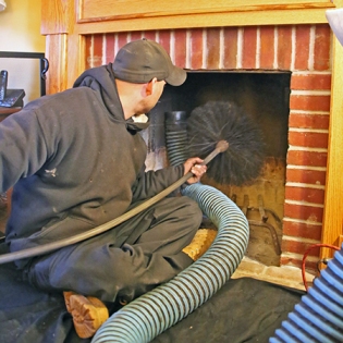 chimney liner quote Providence by 5 Star Chimney Service inspecting chimney liner and providing repair estimate