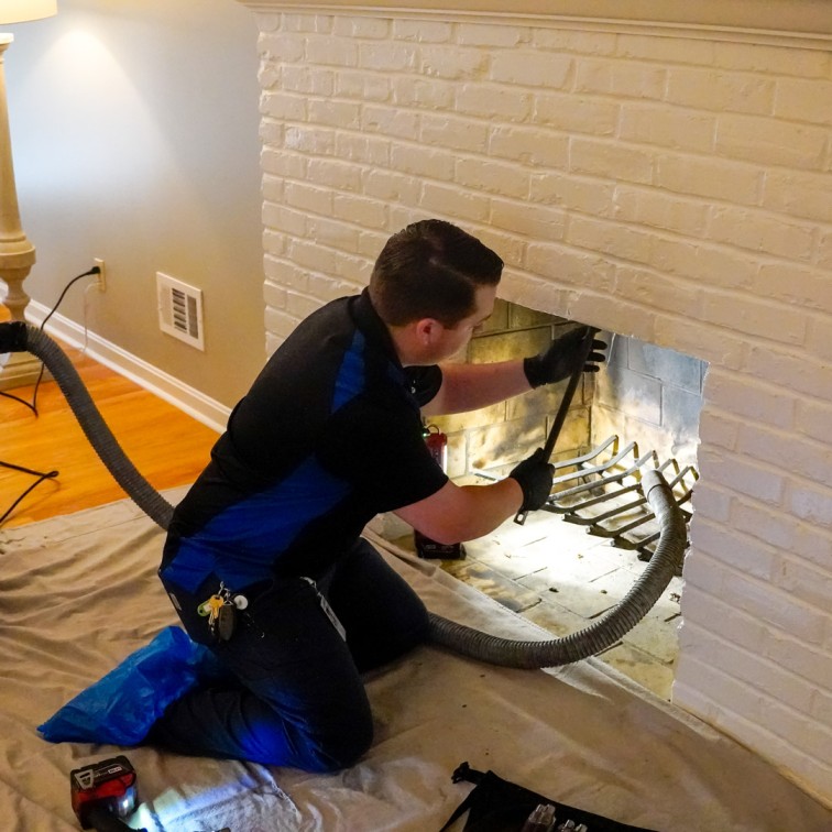 professional fireplace cleaning in Andover Massachusetts removing soot ash and creosote buildup