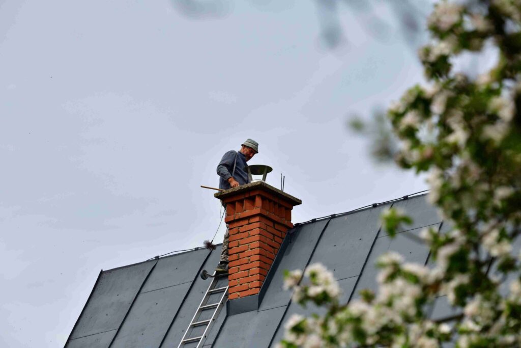 professional chimney sweep service in Worcester MA cleaning chimney flues and removing creosote buildup