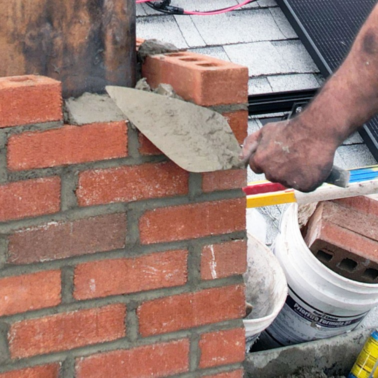 professional masonry chimney repair in Worcester Massachusetts restoring damaged brickwork and mortar joints