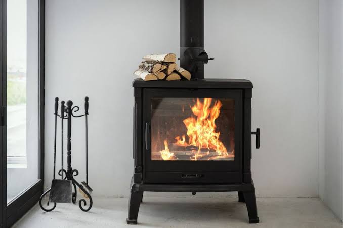 professional wood stove installation in Andover Massachusetts with chimney liner and safe venting system for efficient home heating