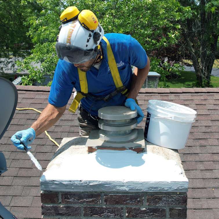 professional chimney crown repair in Andover MA restoring damaged chimney crown and preventing water intrusion